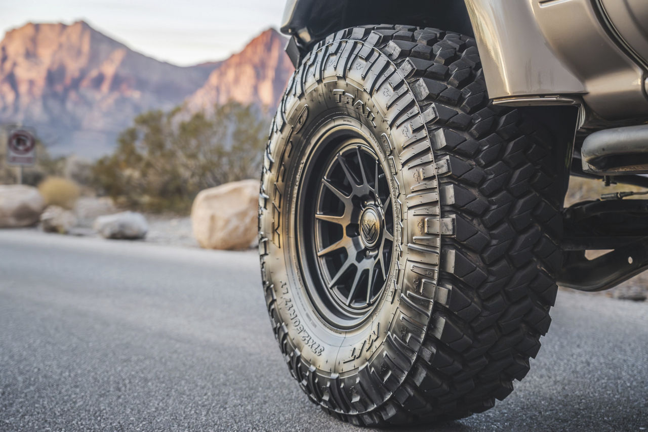 Mud-terrain tire close-up on a truck in the desert