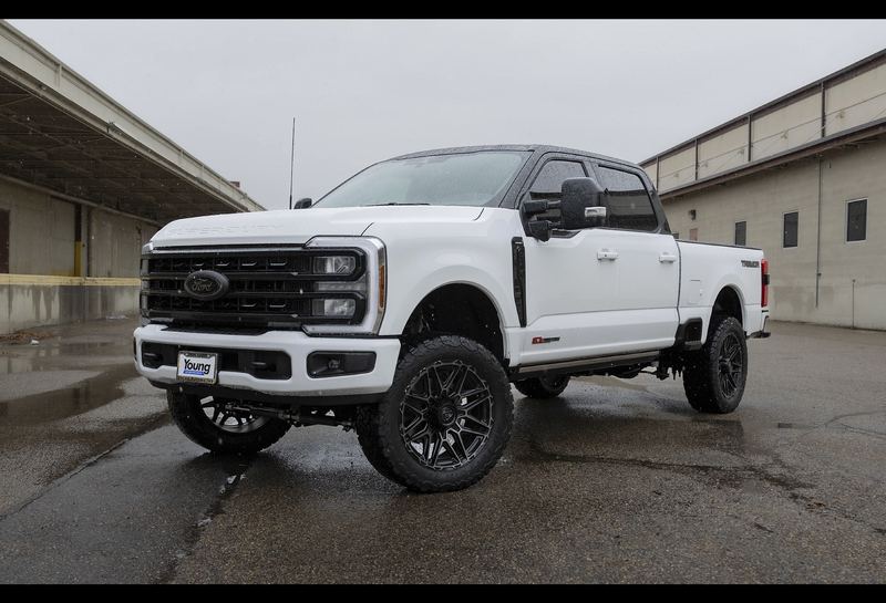 White lifted Ford F-250 Super Duty truck